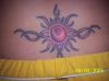 tribal sun lower back tattoo